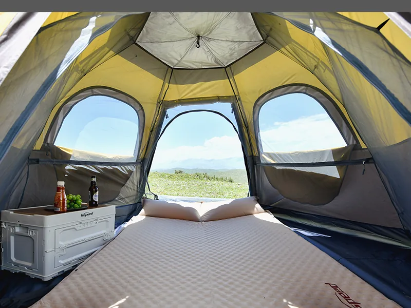 Inside the 4-6 Person Heavy-Duty Hexagon Tent showing the sleeping area and windows
